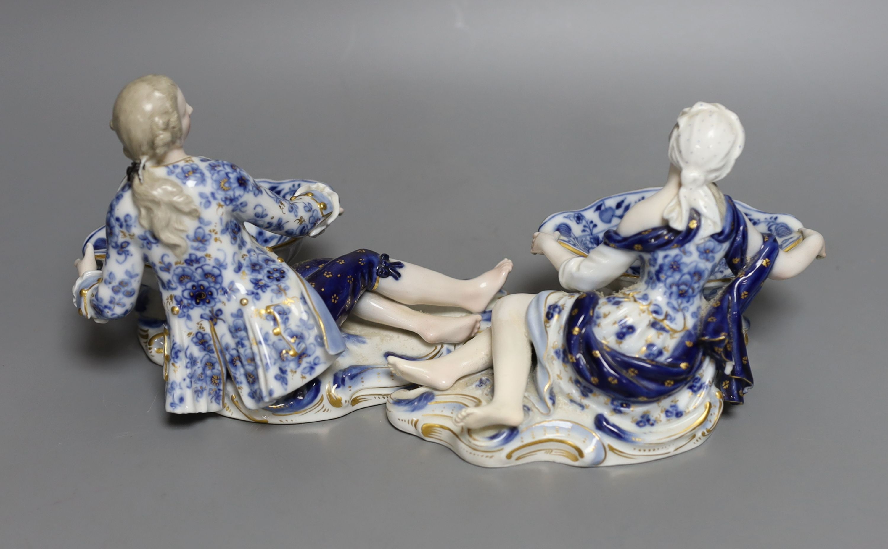 A pair of late 19th century Meissen figural salts, incised numbers ‘2872’ and ‘2873’. 17cm